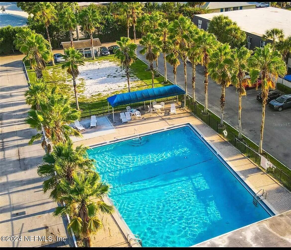 1940 South Conway Road, Unit 2 Orlando, FL 32812 - Photo 16 of 21 a view of a swimming pool with a patio