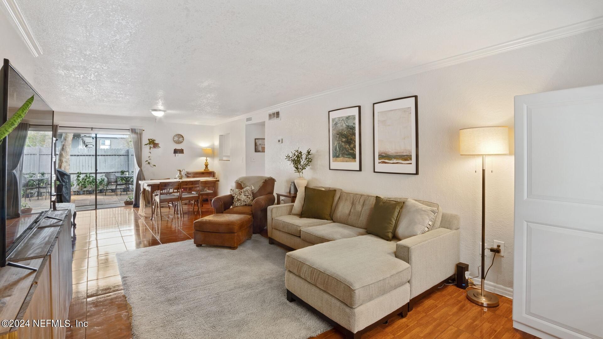 1940 South Conway Road, Unit 2 Orlando, FL 32812 - Photo 3 of 21 a living room with furniture and a couch