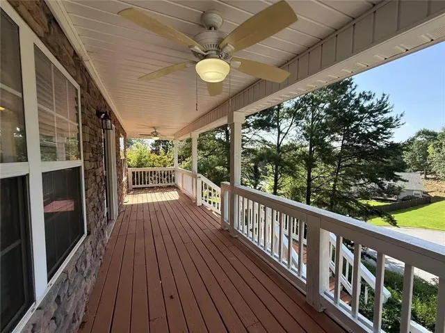 a view of a balcony with wooden floor