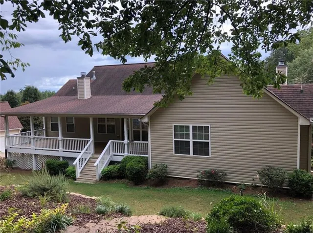a front view of a house with garden