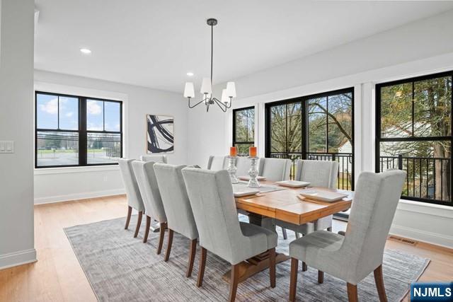 147 Central Avenue, Unit 20 Old Tappan, NJ 07675 - Photo 11 of 50 a view of a dining room with furniture window and wooden floor