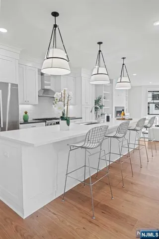 a living room with furniture a table and chairs