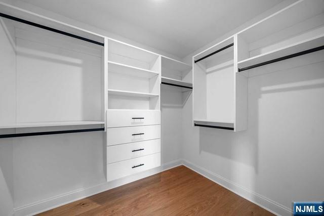 147 Central Avenue, Unit 20 Old Tappan, NJ 07675 - Photo 24 of 50 a view of walk in closet with empty racks