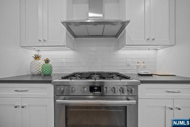 147 Central Avenue, Unit 20 Old Tappan, NJ 07675 - Photo 9 of 50 a stove top oven sitting inside of a kitchen