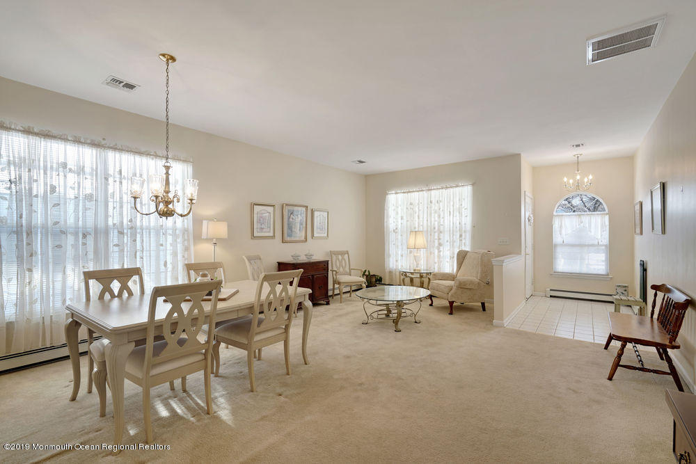 47 Wordsworth Road Brick, NJ 08724 - Photo 11 of 42 a living room with furniture and a large window