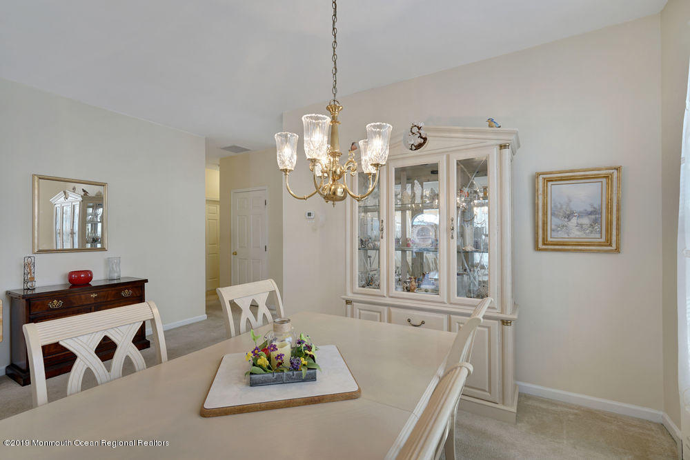 47 Wordsworth Road Brick, NJ 08724 - Photo 13 of 42 a dining room with wooden floor and chandelier