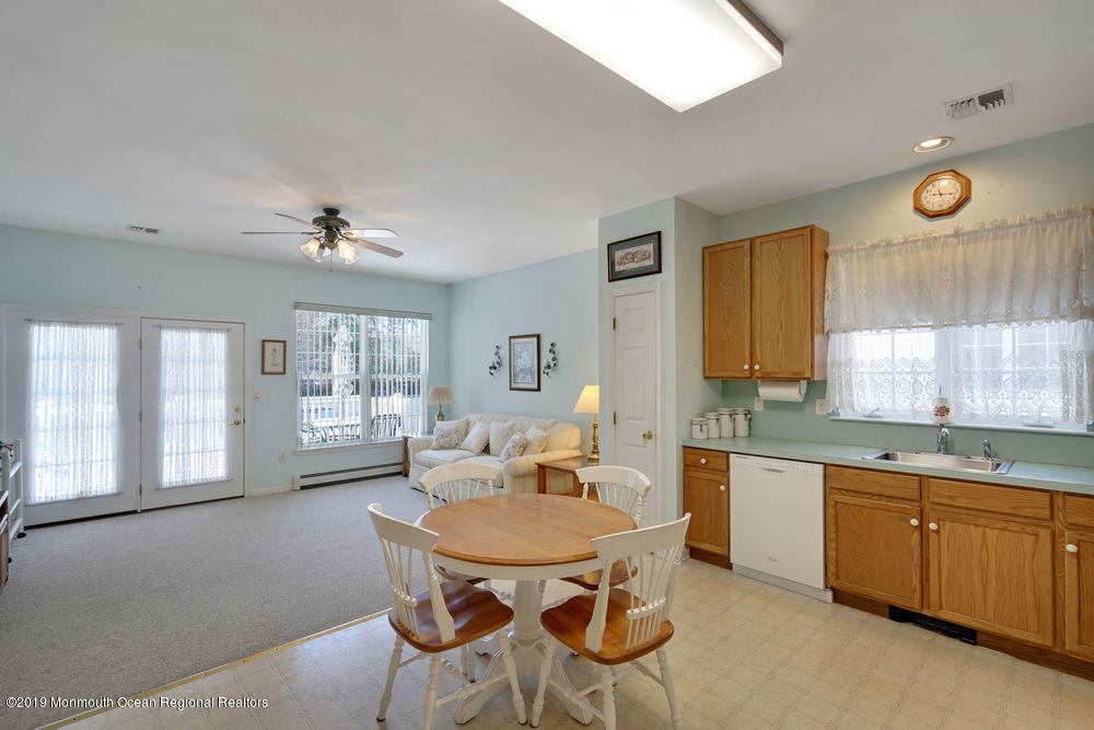 47 Wordsworth Road Brick, NJ 08724 - Photo 15 of 42 a kitchen with a table chairs sink and cabinets