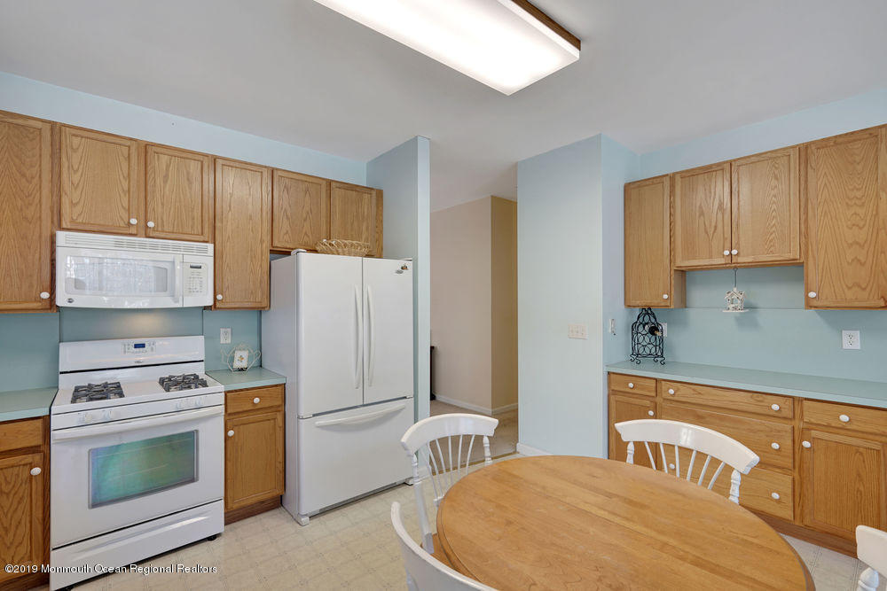 47 Wordsworth Road Brick, NJ 08724 - Photo 17 of 42 a kitchen with a stove a refrigerator and cabinets