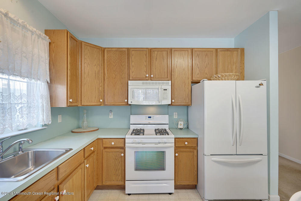 47 Wordsworth Road Brick, NJ 08724 - Photo 19 of 42 a kitchen with a refrigerator sink and cabinets