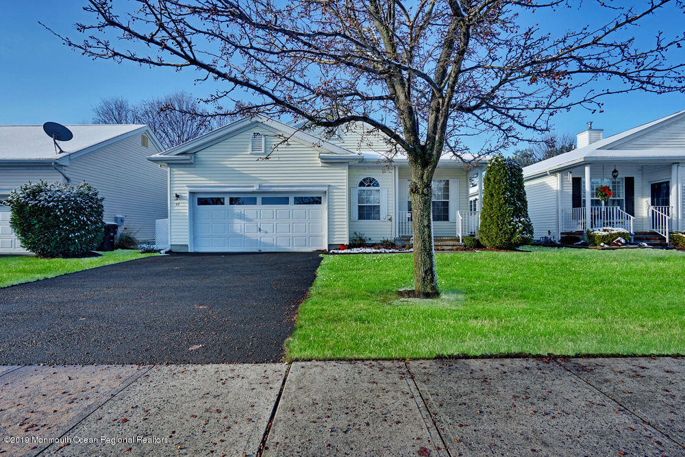 47 Wordsworth Road Brick, NJ 08724 - Photo 2 of 42 a front view of a house with a yard and garage