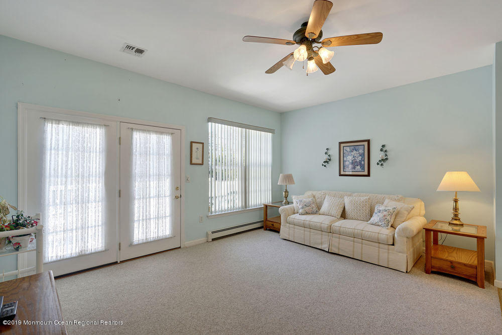 47 Wordsworth Road Brick, NJ 08724 - Photo 21 of 42 a living room with furniture and a large window