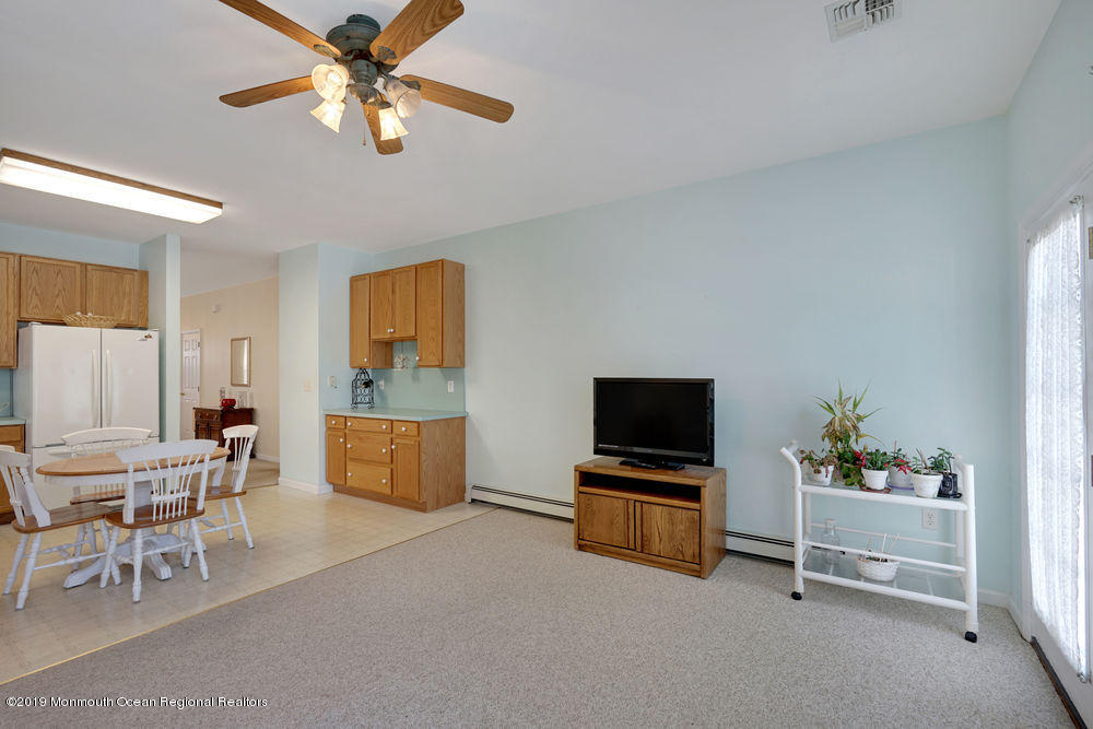 47 Wordsworth Road Brick, NJ 08724 - Photo 23 of 42 a living room with furniture and a flat screen tv