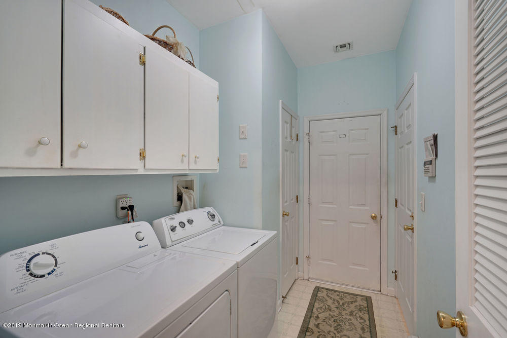 47 Wordsworth Road Brick, NJ 08724 - Photo 26 of 42 a utility room with cabinets washer and dryer
