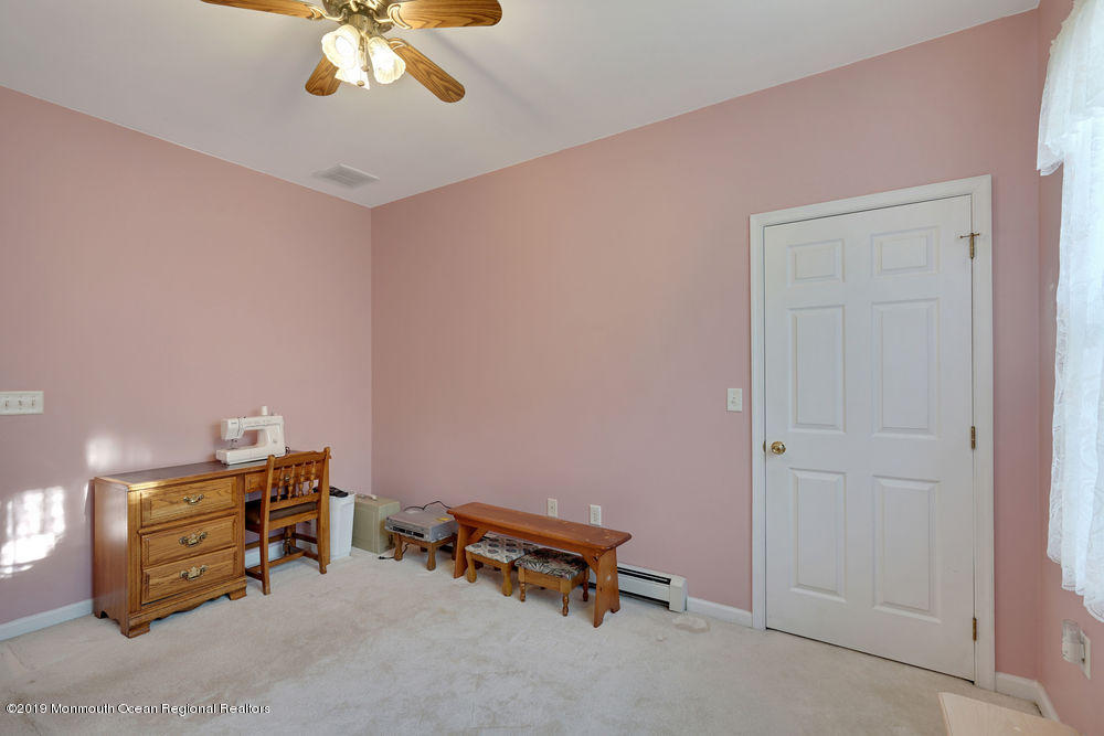 47 Wordsworth Road Brick, NJ 08724 - Photo 28 of 42 a room with furniture and a chandelier