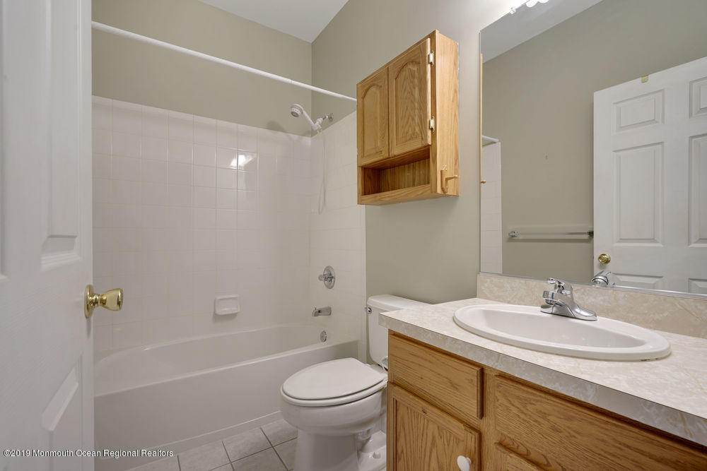 47 Wordsworth Road Brick, NJ 08724 - Photo 31 of 42 a bathroom with a sink a toilet and shower