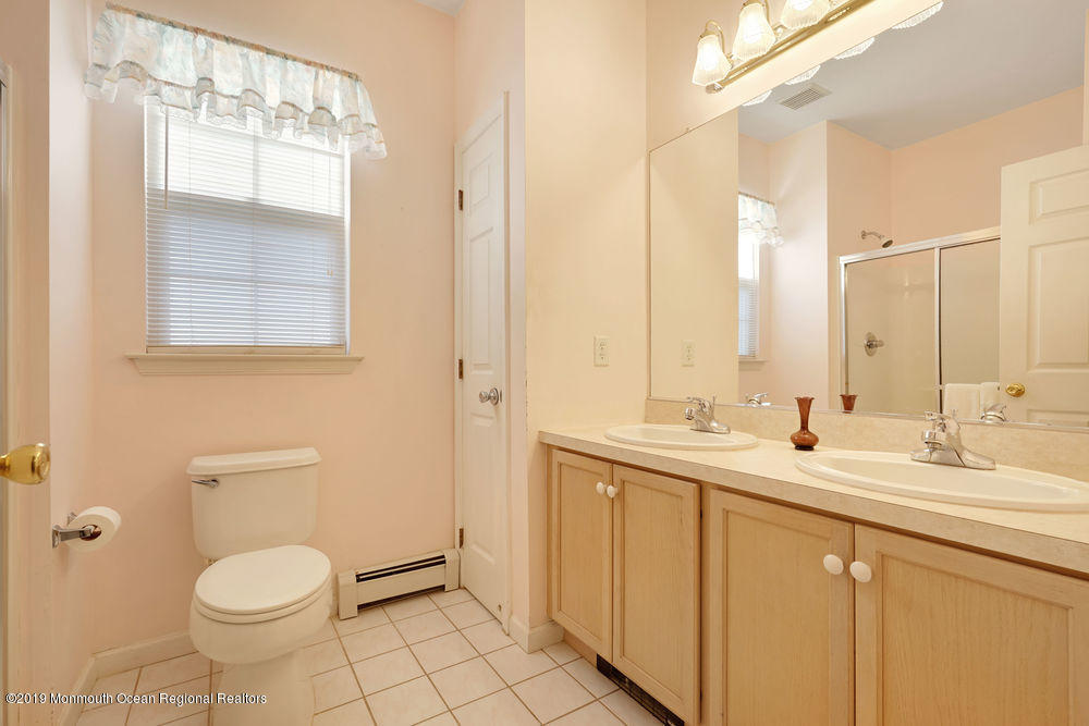 47 Wordsworth Road Brick, NJ 08724 - Photo 36 of 42 a bathroom with a toilet sink and mirror