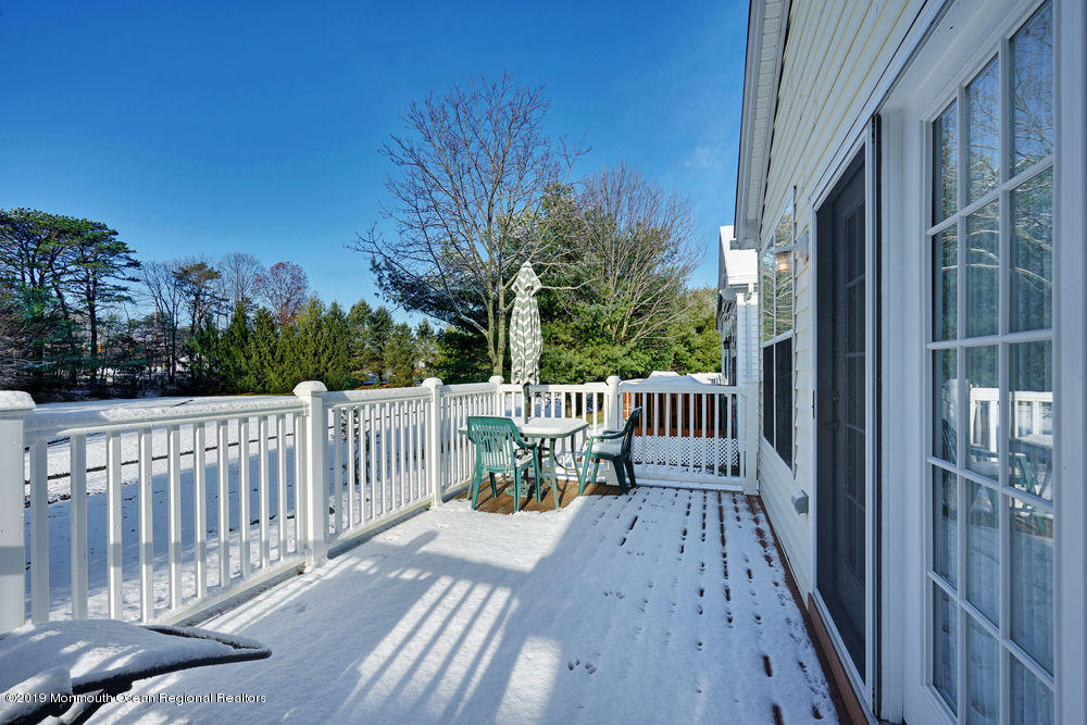 47 Wordsworth Road Brick, NJ 08724 - Photo 40 of 42 a view of a deck with two chair and table