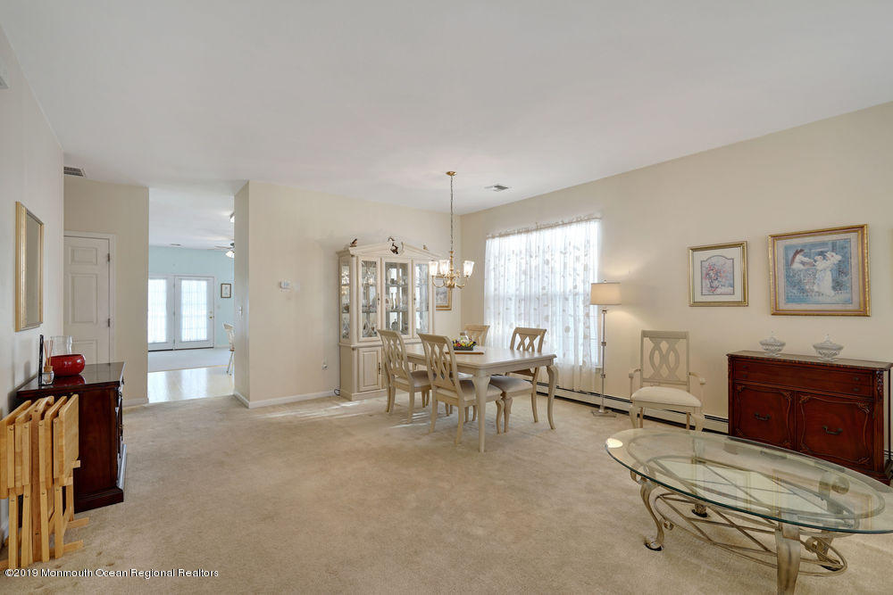 47 Wordsworth Road Brick, NJ 08724 - Photo 6 of 42 a living room with furniture a dining table and a piano table