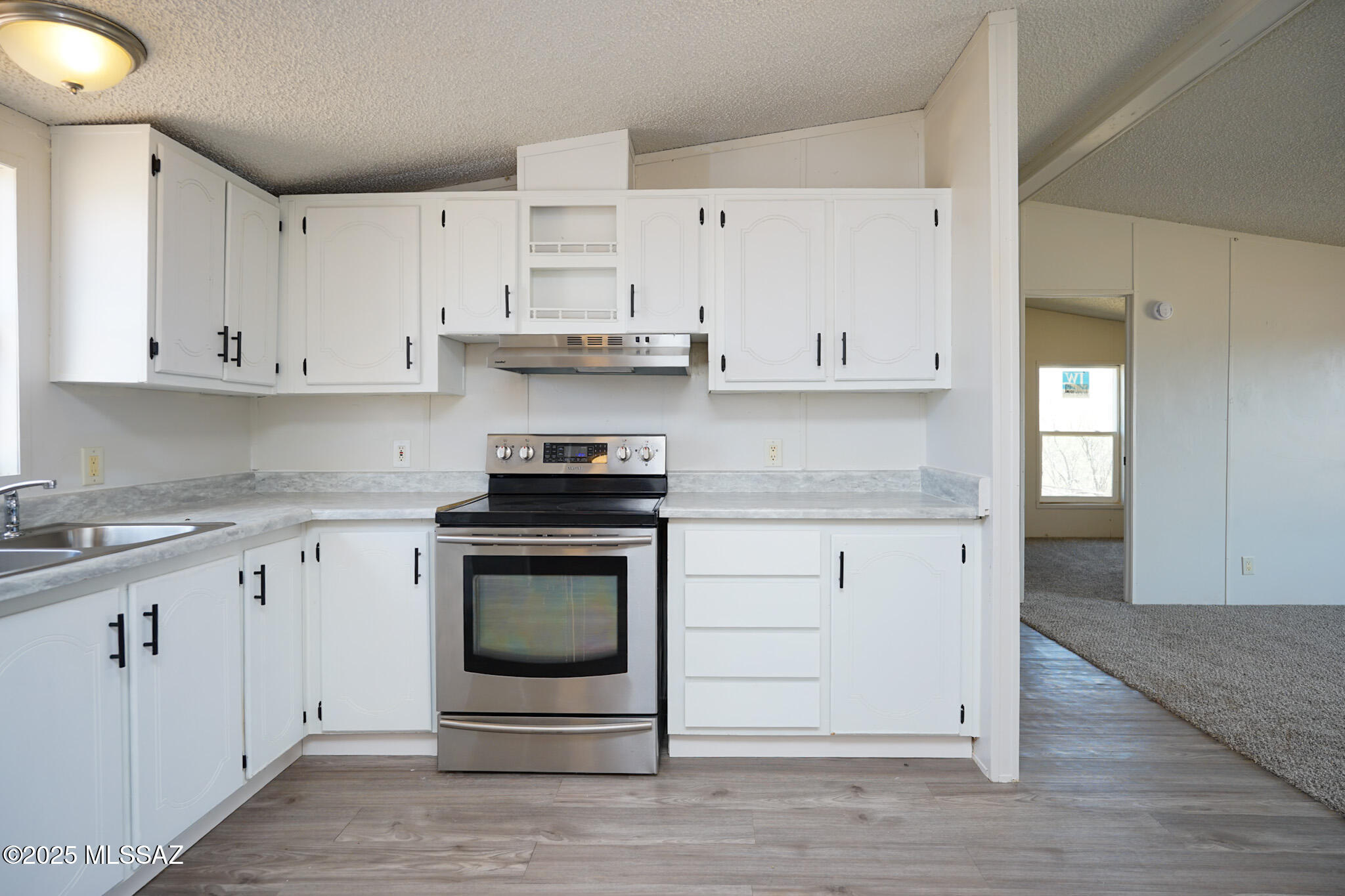 5188 East Phillips Road Willcox, AZ 85643 - Photo 9 of 43 a kitchen with cabinets appliances and a sink