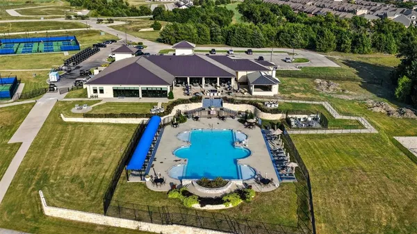an aerial view of a house with a lake view