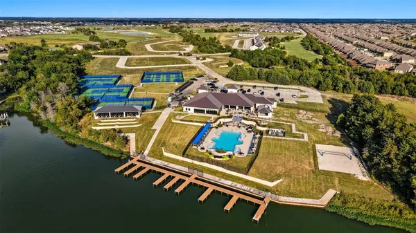 a aerial view of a house with garden space and street view