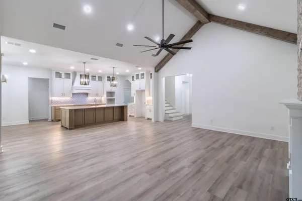 a view of a kitchen with a sink and a window