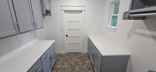 a bathroom with a double vanity sink mirror and