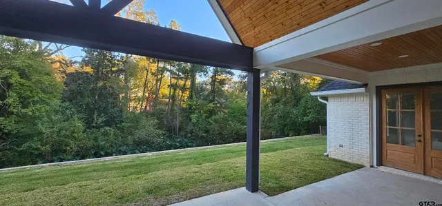 a view of a backyard with garden