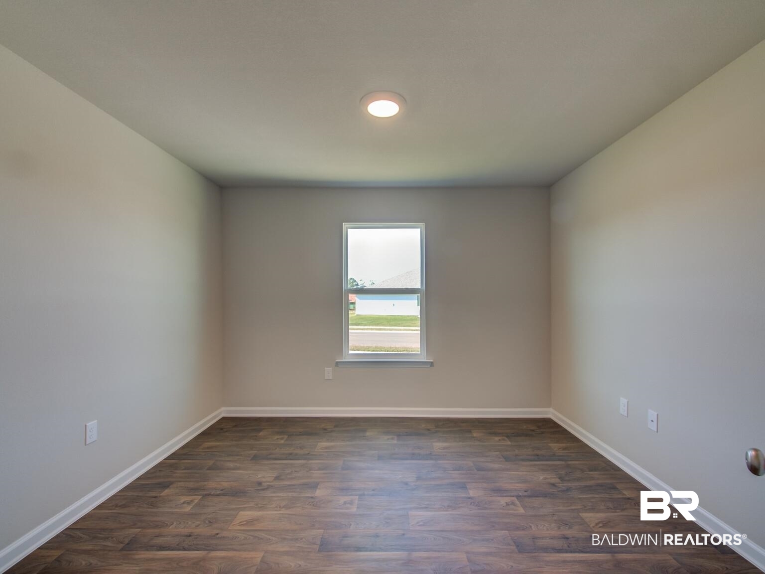 23953 Citation Loop Daphne, AL 36526 - Photo 26 of 49 Spare room with dark wood-type flooring and baseboards
