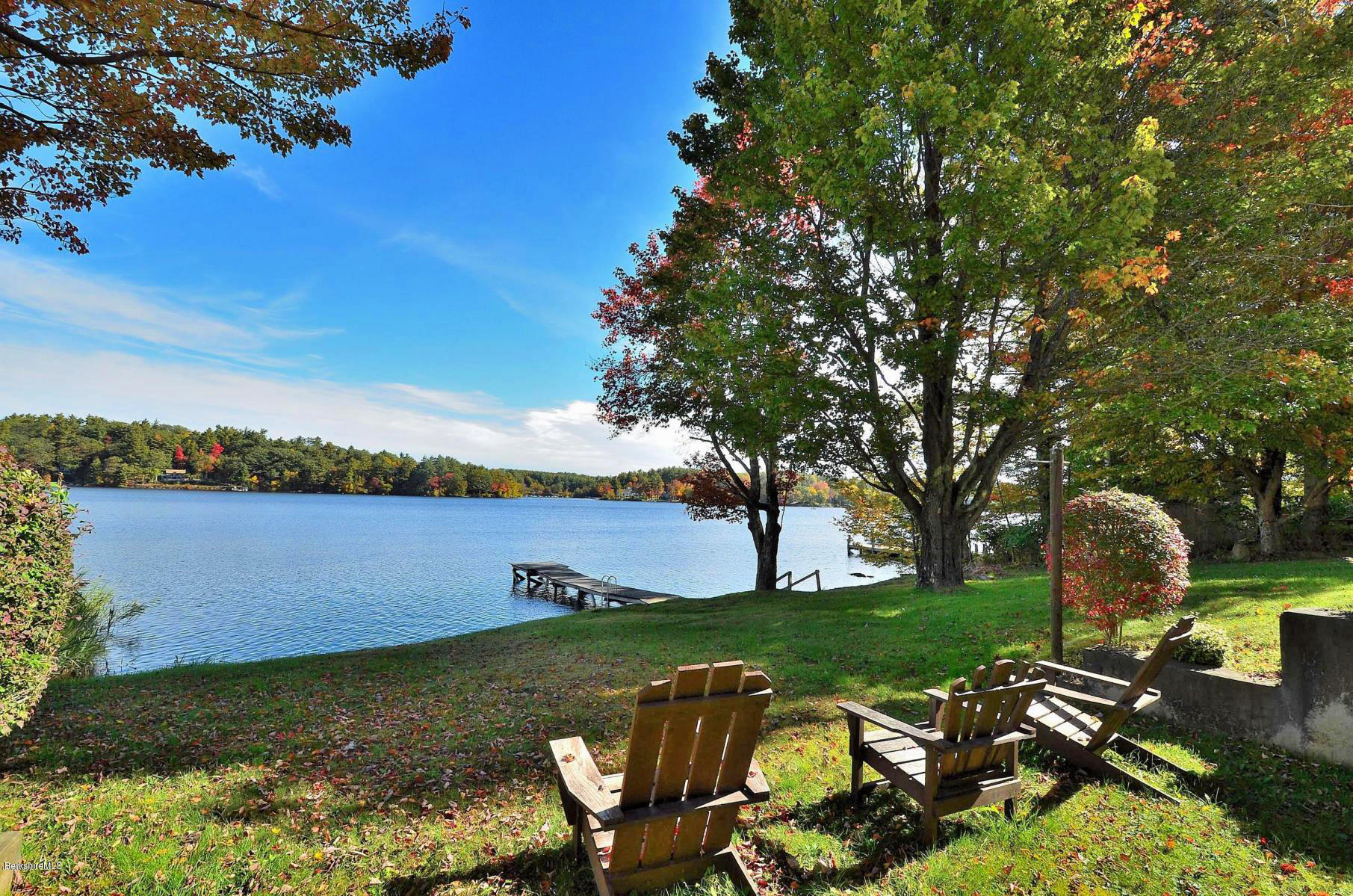 59 Pine Grove Ridge Otis, MA 01029 - Photo 5 of 20 a view of a lake with lawn chairs