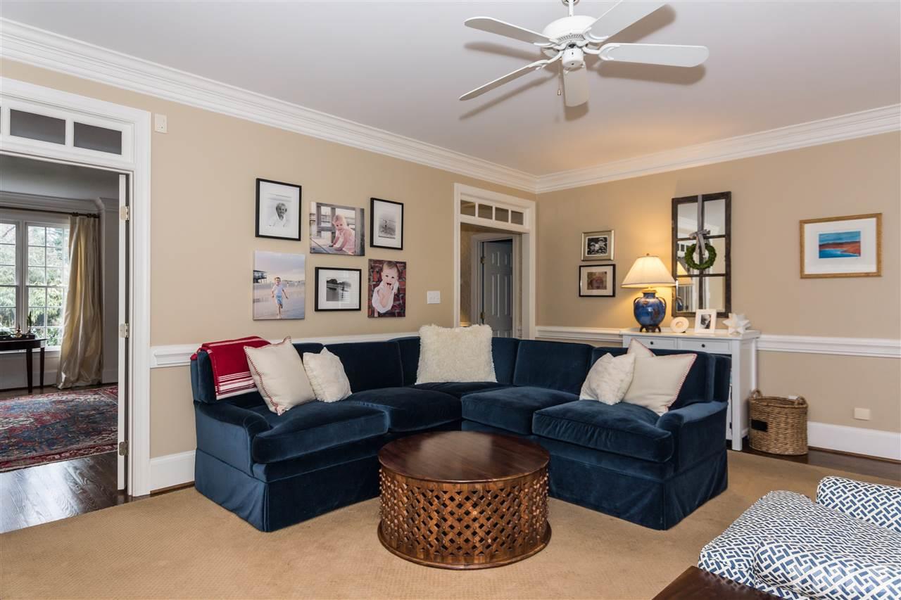 1712 Craig Street Raleigh, NC 27608 - Photo 11 of 25 a living room with furniture and a painting