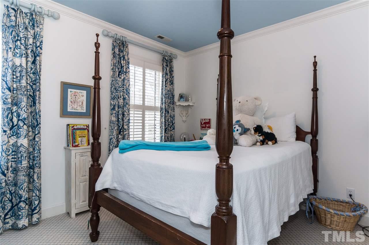 1712 Craig Street Raleigh, NC 27608 - Photo 17 of 25 a bedroom with a bed and a window