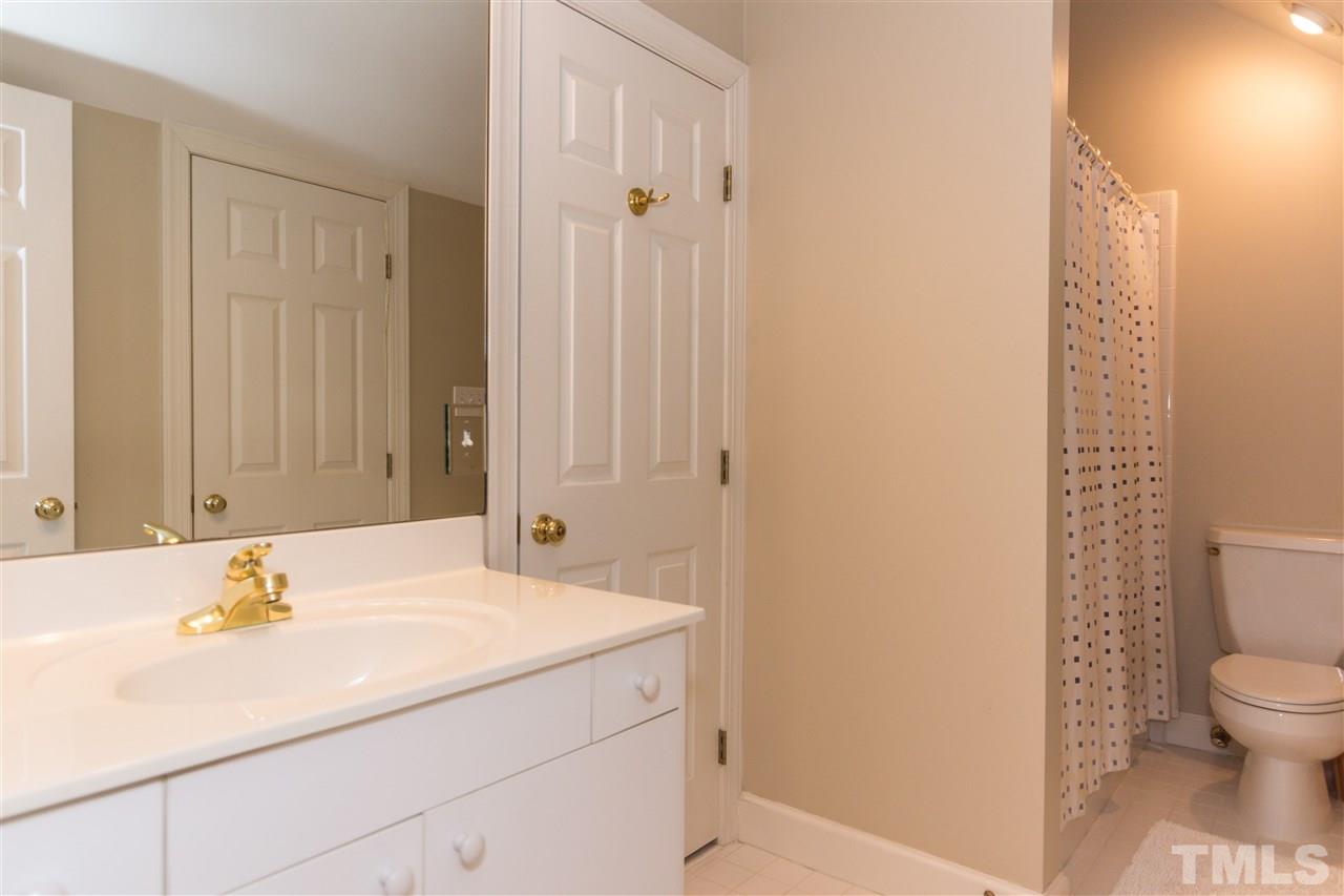 1712 Craig Street Raleigh, NC 27608 - Photo 19 of 25 a bathroom with a sink and a toilet