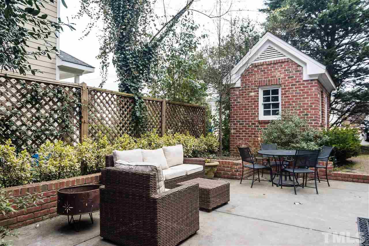 1712 Craig Street Raleigh, NC 27608 - Photo 24 of 25 a backyard of a house with outdoor seating