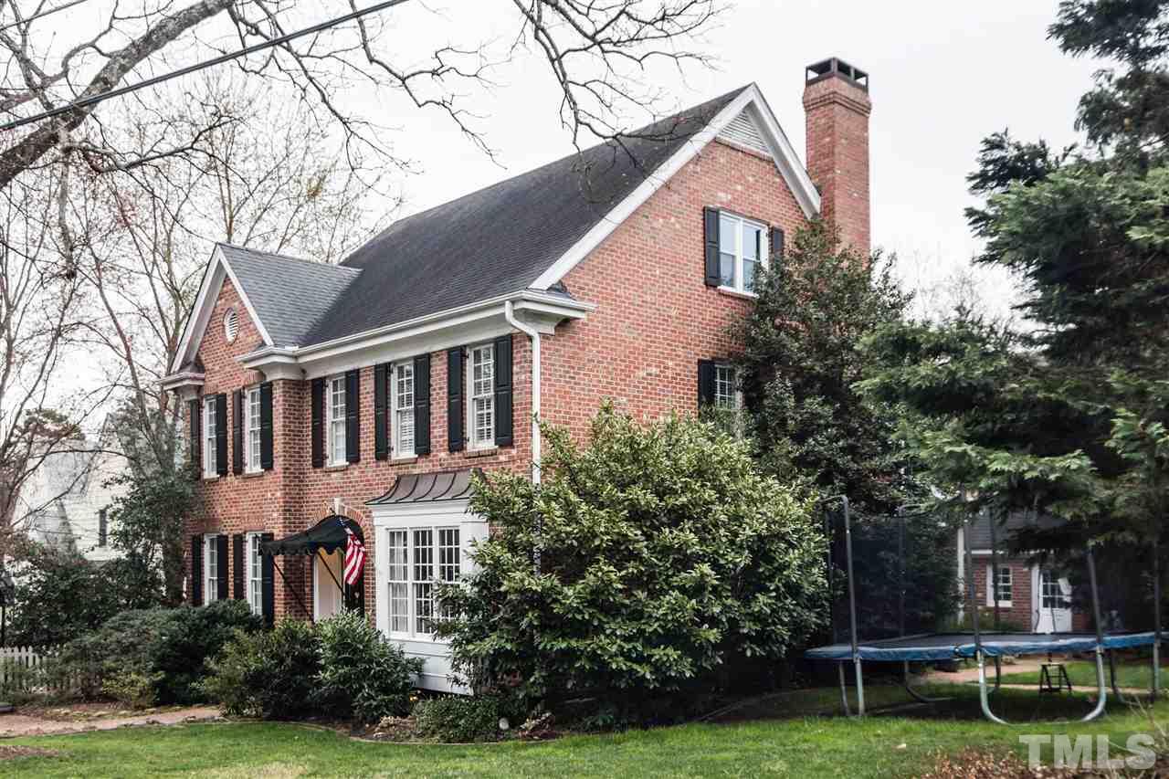 1712 Craig Street Raleigh, NC 27608 - Photo 25 of 25 a front view of a house with a yard and green space
