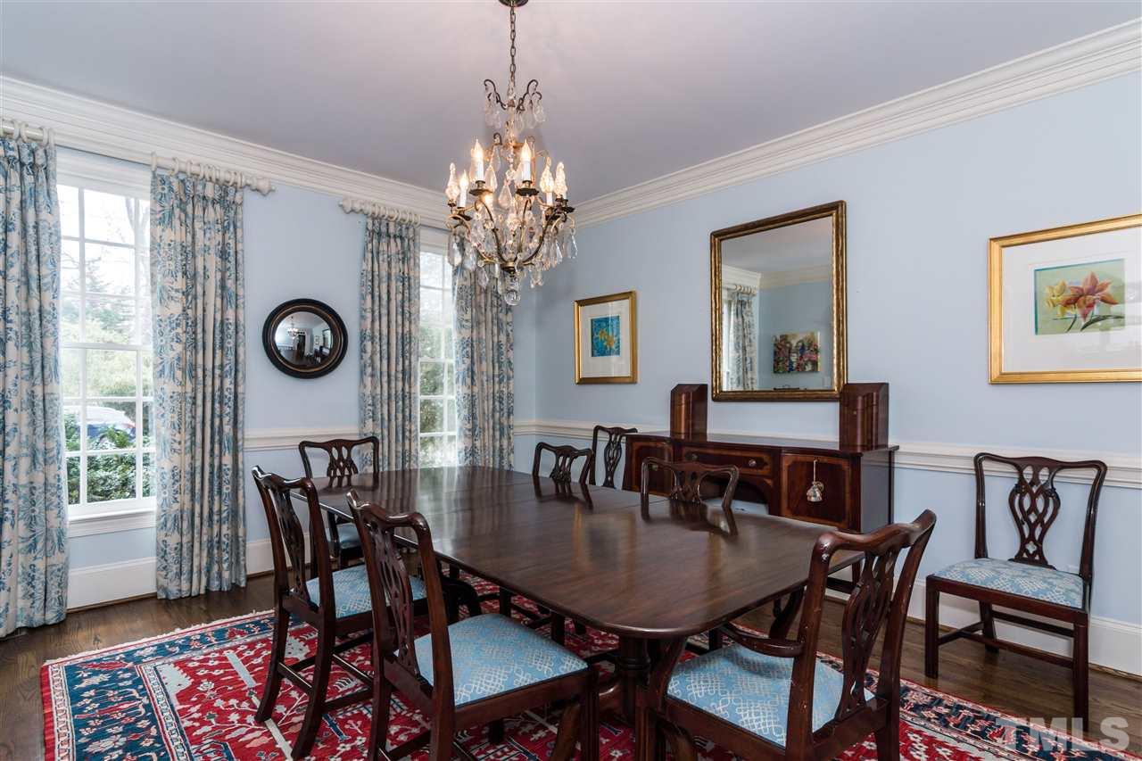 1712 Craig Street Raleigh, NC 27608 - Photo 4 of 25 a view of a dining room with furniture and wooden floor