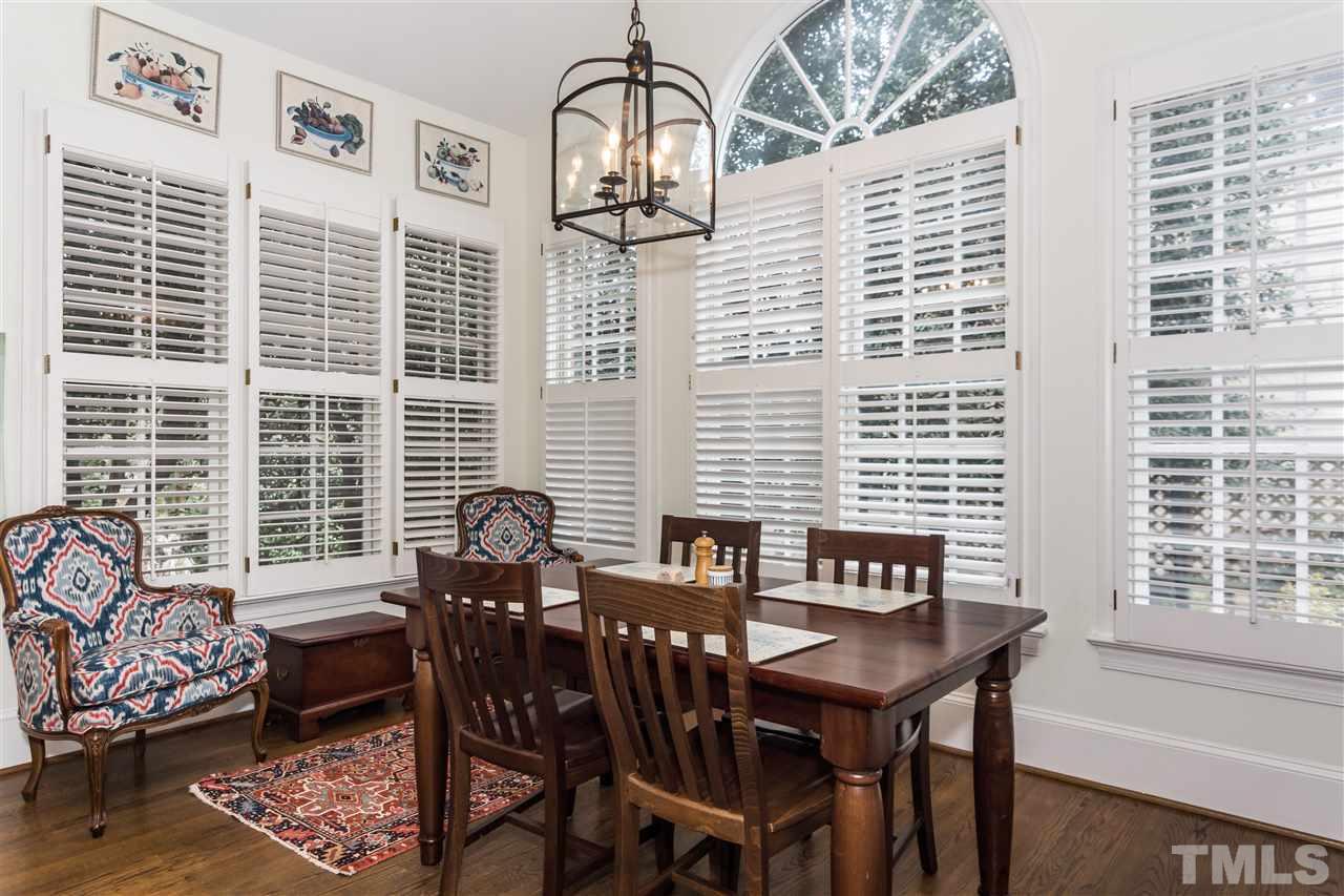 1712 Craig Street Raleigh, NC 27608 - Photo 9 of 25 a view of a dining room with furniture and windows