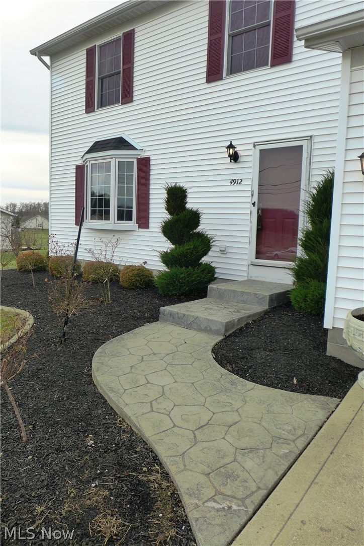 4912 South County Line Road Madison, OH 44057 - Photo 2 of 23 Here is a better view of the stamped walkway and landscaping!