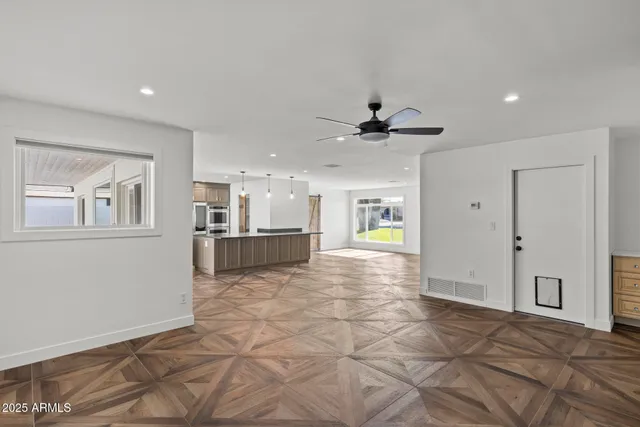 a bathroom with a granite countertop double vanity sink and mirror