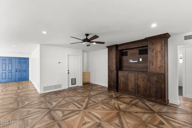 a bathroom with a toilet and a shower curtain