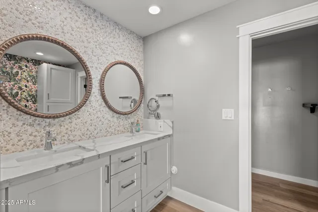a bathroom with a sink and mirror