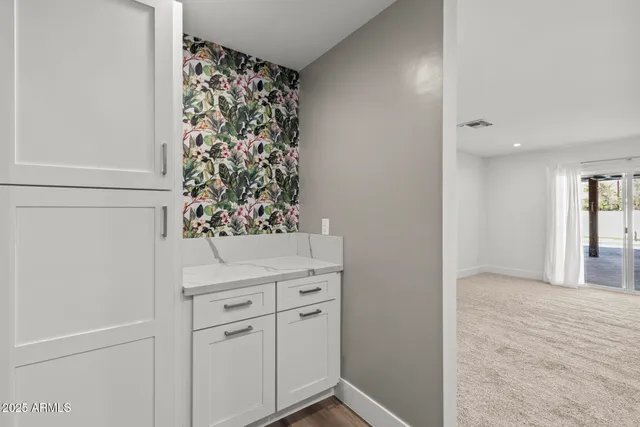 a bathroom with a double vanity sink mirror and