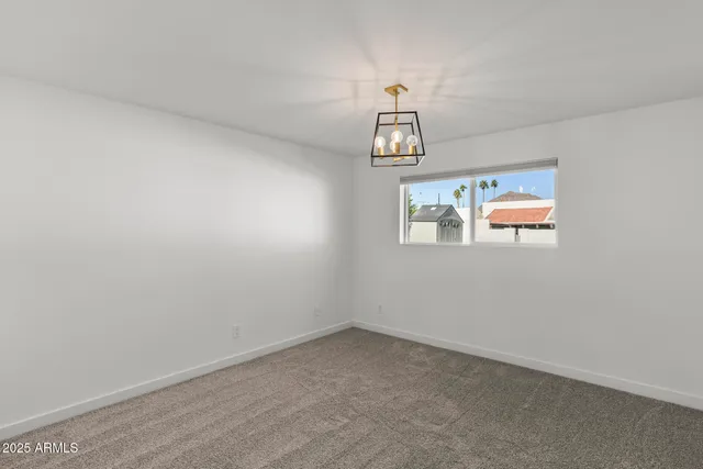 a view of swimming pool with a lawn chairs