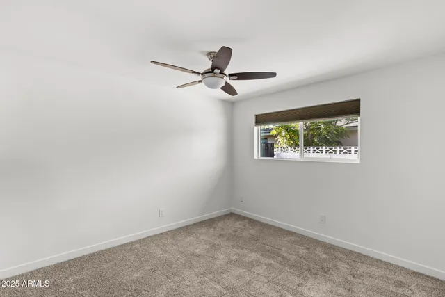 an aerial view of a house with outdoor space and lake view
