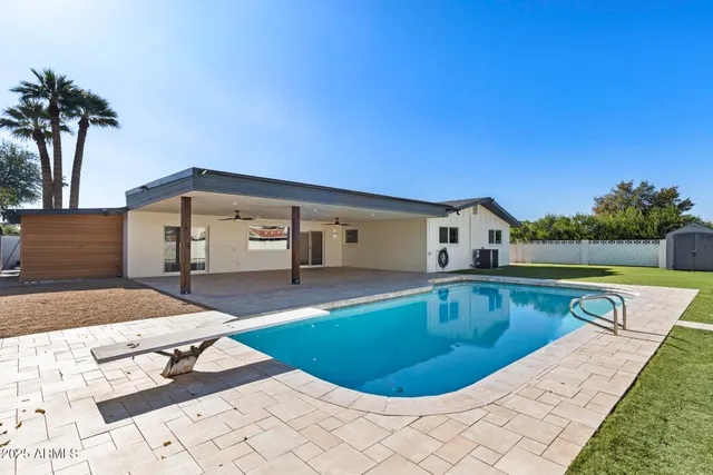 a view of a kitchen with refrigerator and a stove