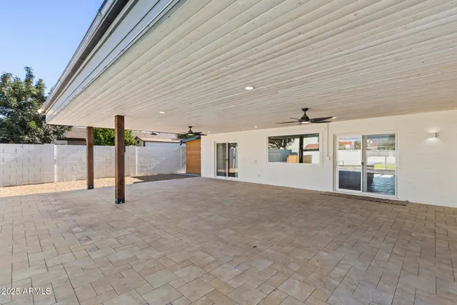an aerial view of a house with a swimming pool