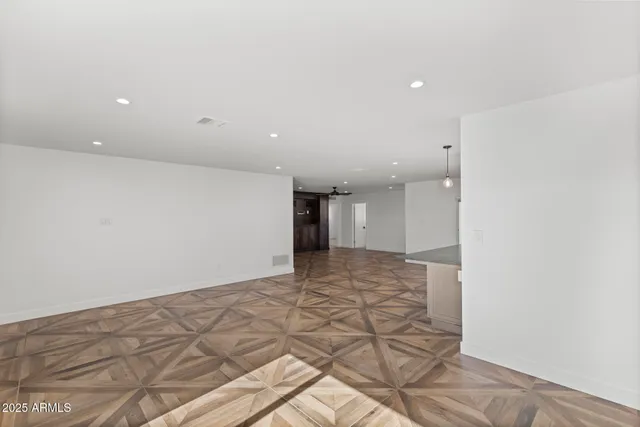 a kitchen with stainless steel appliances a sink a counter top space cabinets and a counter top space