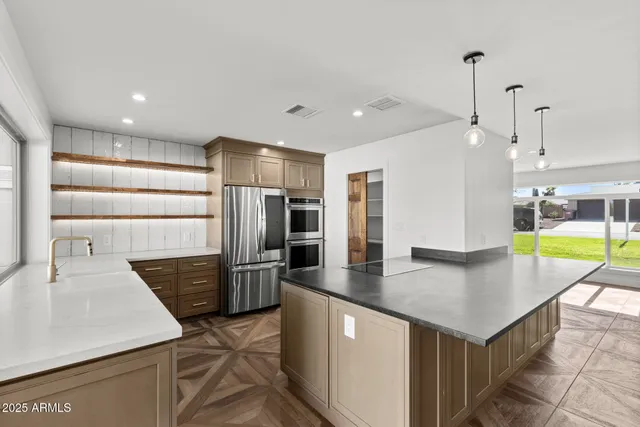 a kitchen with a sink cabinets and window