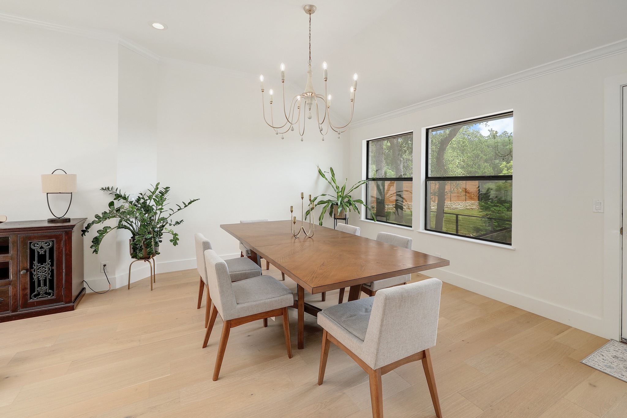 7705 Jester Boulevard Austin, TX 78730 - Photo 7 of 36 Natural light floods this inviting dining room, creating a perfect ambiance for meals and gatherings.