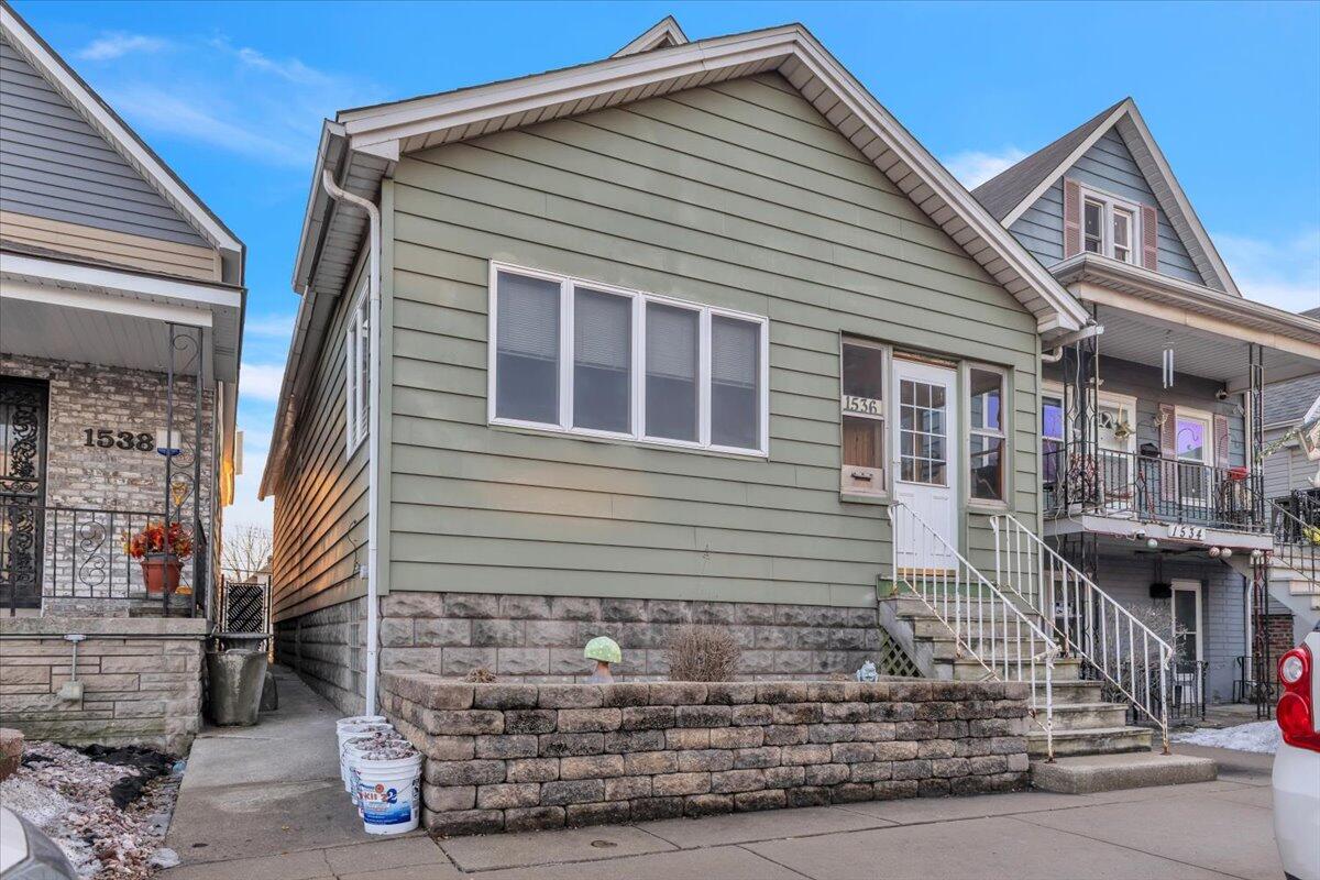 a front view of a house with garage